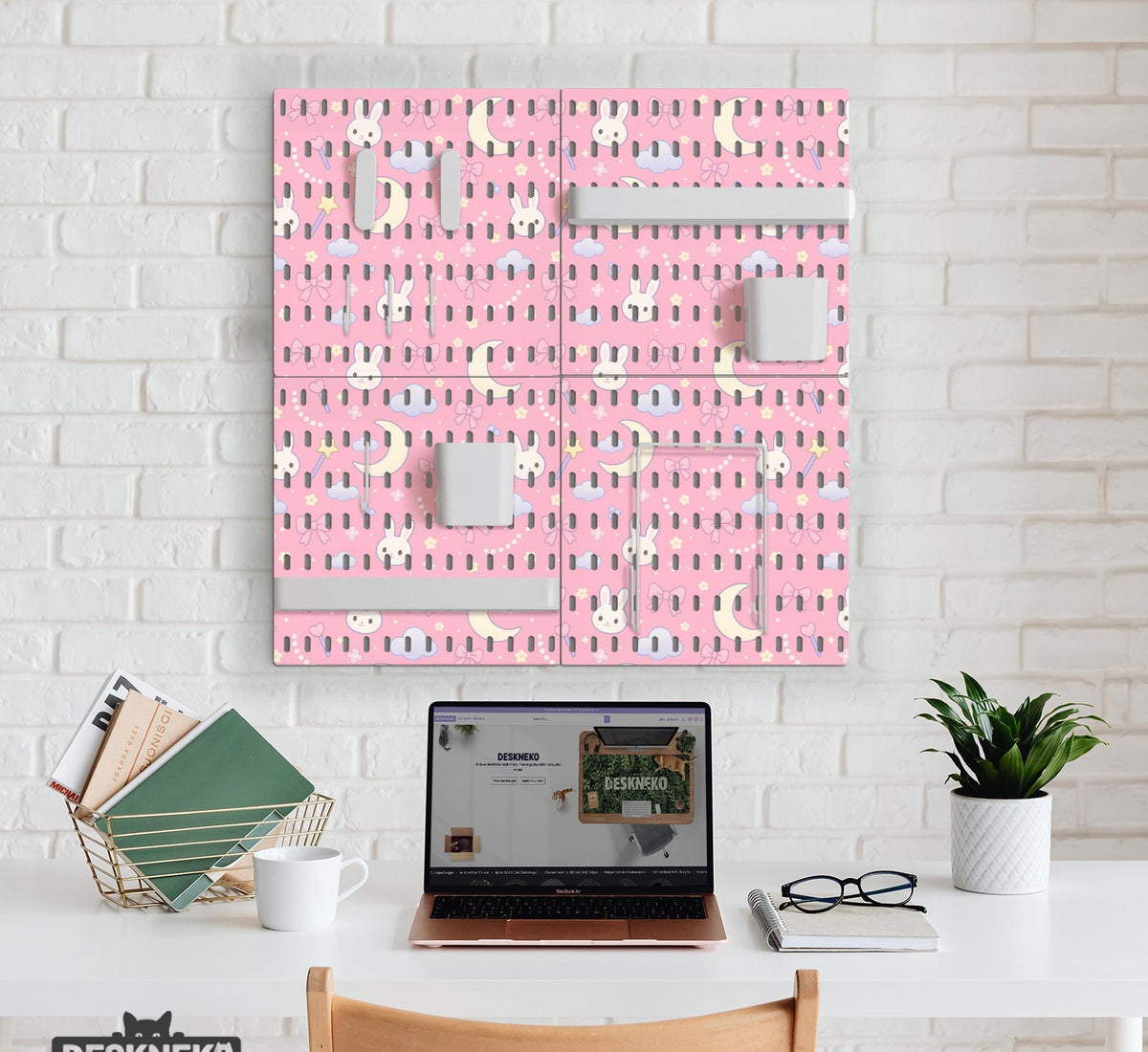 Pink pegboard panels with a kawaii bunny, cloud, moon, bow, and star pattern shown as a wall organizer set.