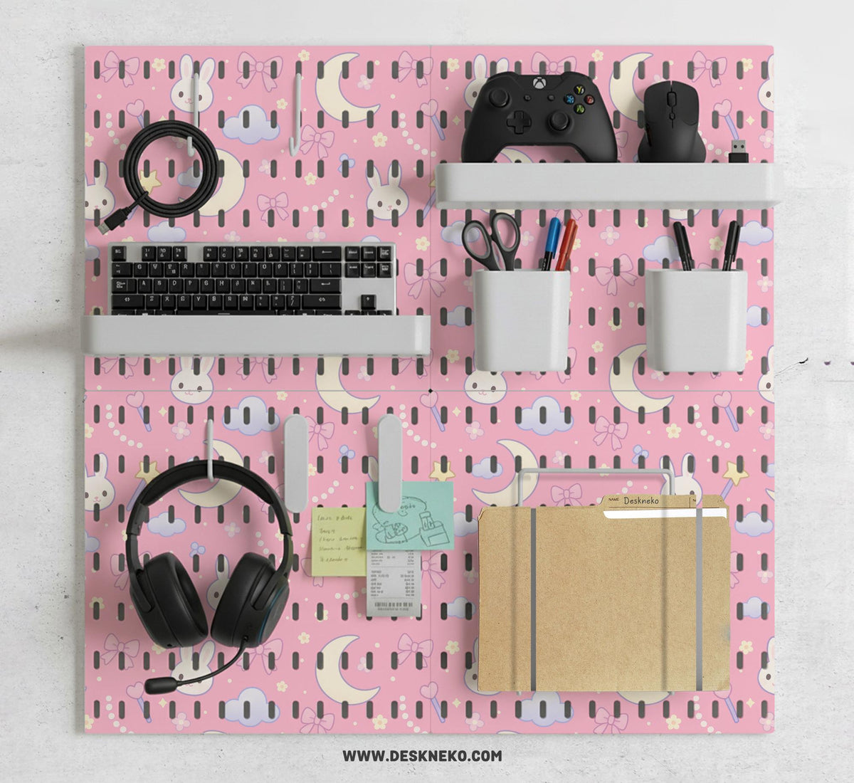 Pink pegboard panels with a kawaii bunny, cloud, moon, bow, and star pattern shown as a wall organizer set.