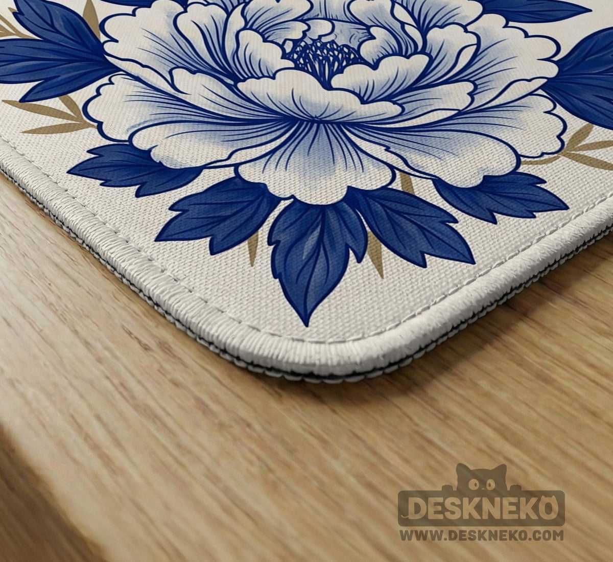 Blue and white mahjong mat with cranes, floral porcelain-style artwork, a cream center area, and a decorative border.