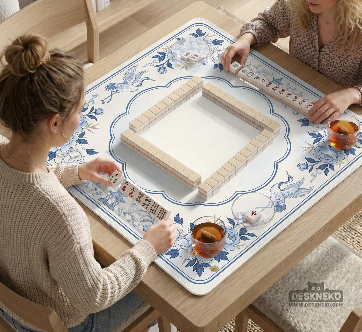 Square mahjong mat with a blue chinoiserie floral pattern on a light background.