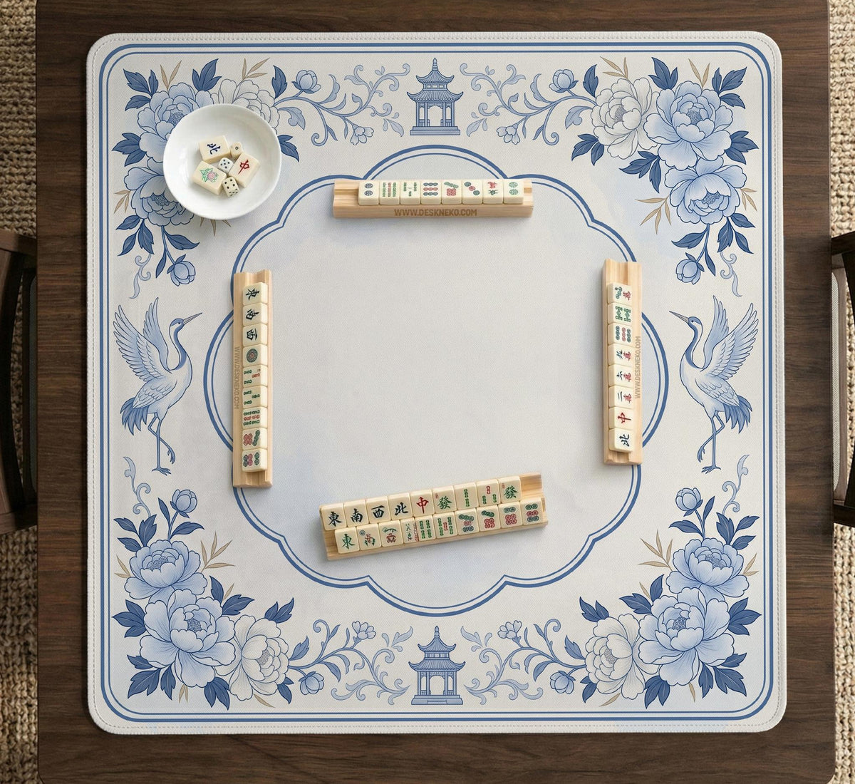 Square mahjong mat with a blue chinoiserie floral pattern on a light background.