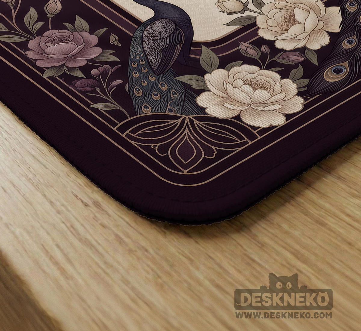 Square mahjong mat with a dark plum border, ivory floral pattern, muted sage leaves, and a decorative peacock garden design.