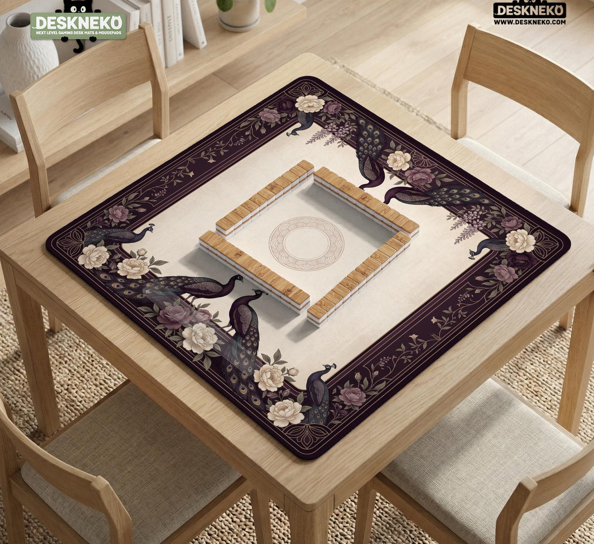 Square mahjong mat with a dark plum border, ivory floral pattern, muted sage leaves, and a decorative peacock garden design.