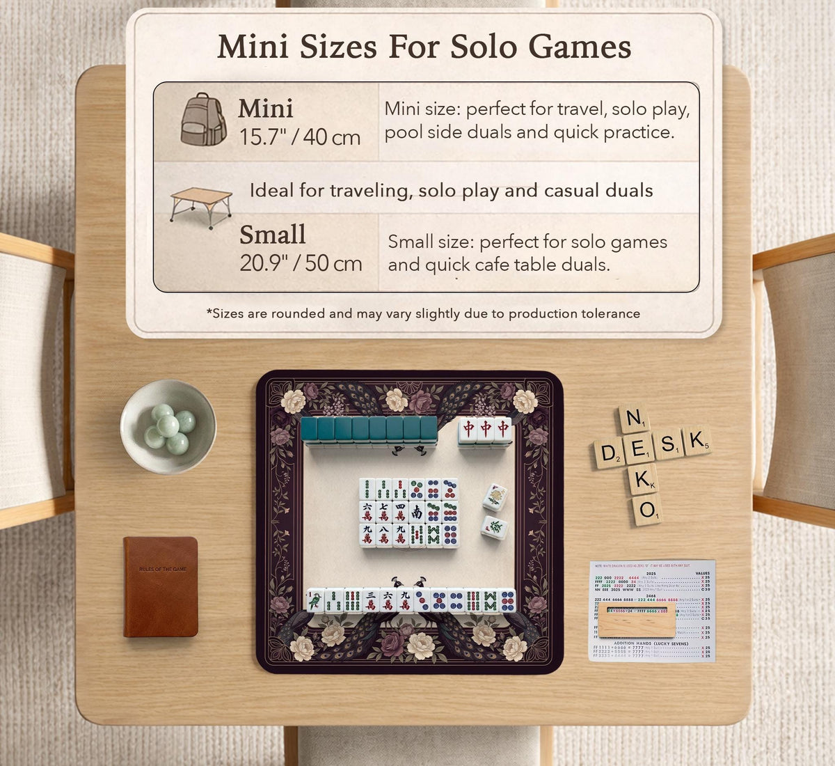 Square mahjong mat with a dark plum border, ivory floral pattern, muted sage leaves, and a decorative peacock garden design.