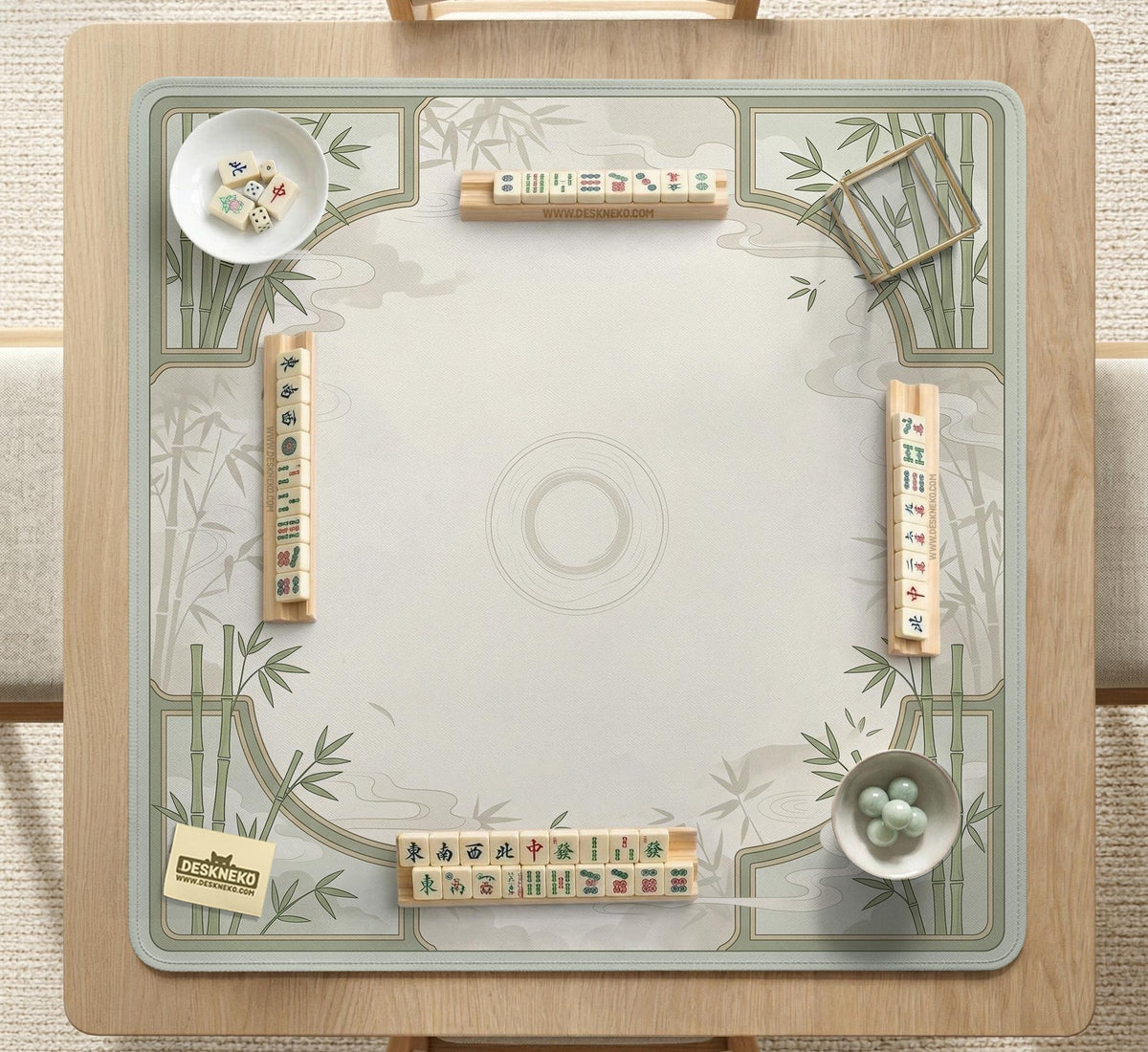 Square light green mahjong mat with bamboo stalks, soft ivory details, botanical shadows, mist lines, and a circular center design.