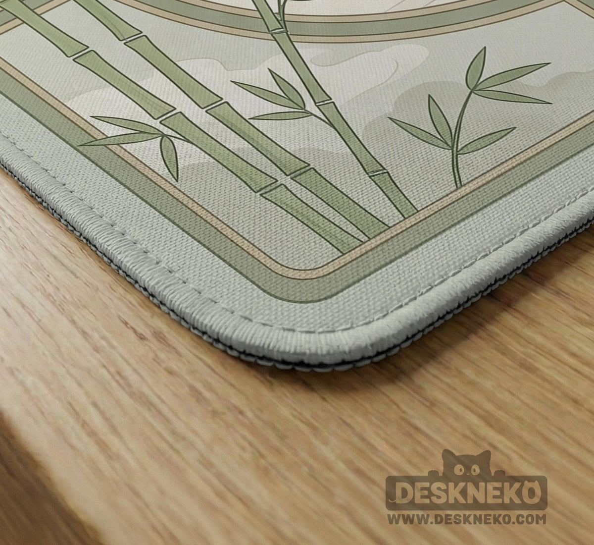 Square mahjong table mat with a pale cream center and green bamboo chinoiserie corners and border.