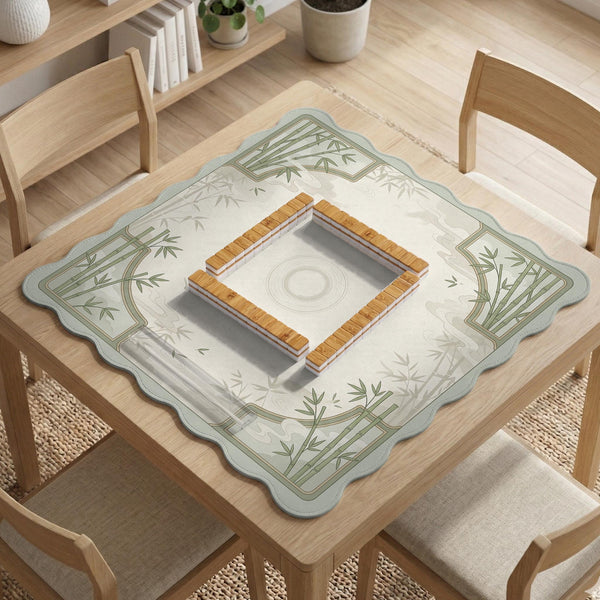 Square mahjong table mat with a pale cream center and green bamboo chinoiserie corners and border.