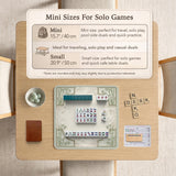 Square mahjong table mat with a pale cream center and green bamboo chinoiserie corners and border.