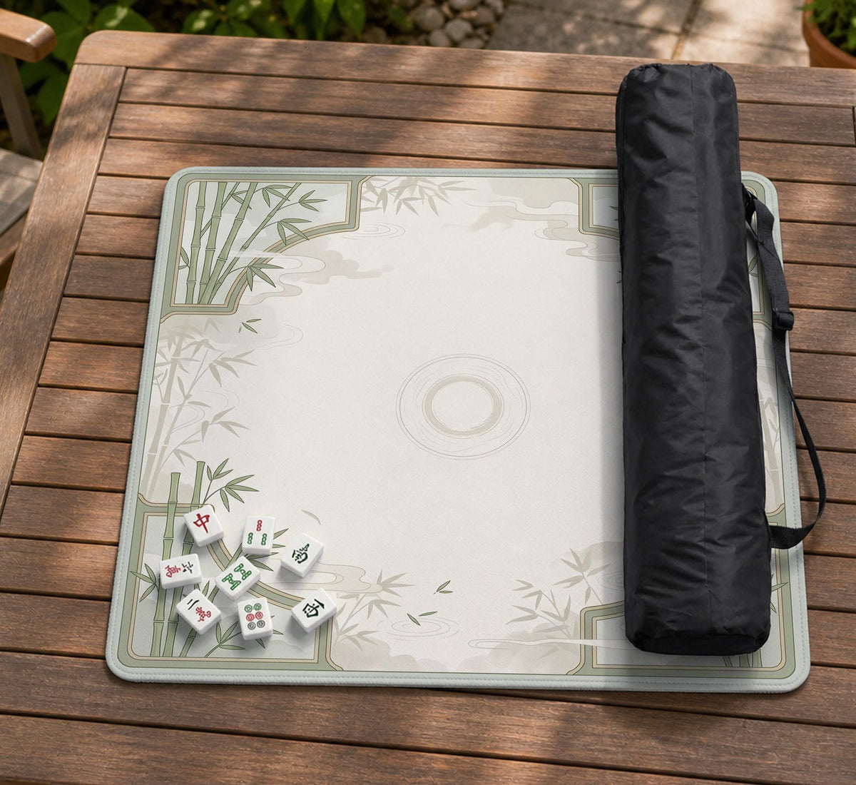Square mahjong table mat with a pale cream center and green bamboo chinoiserie corners and border.