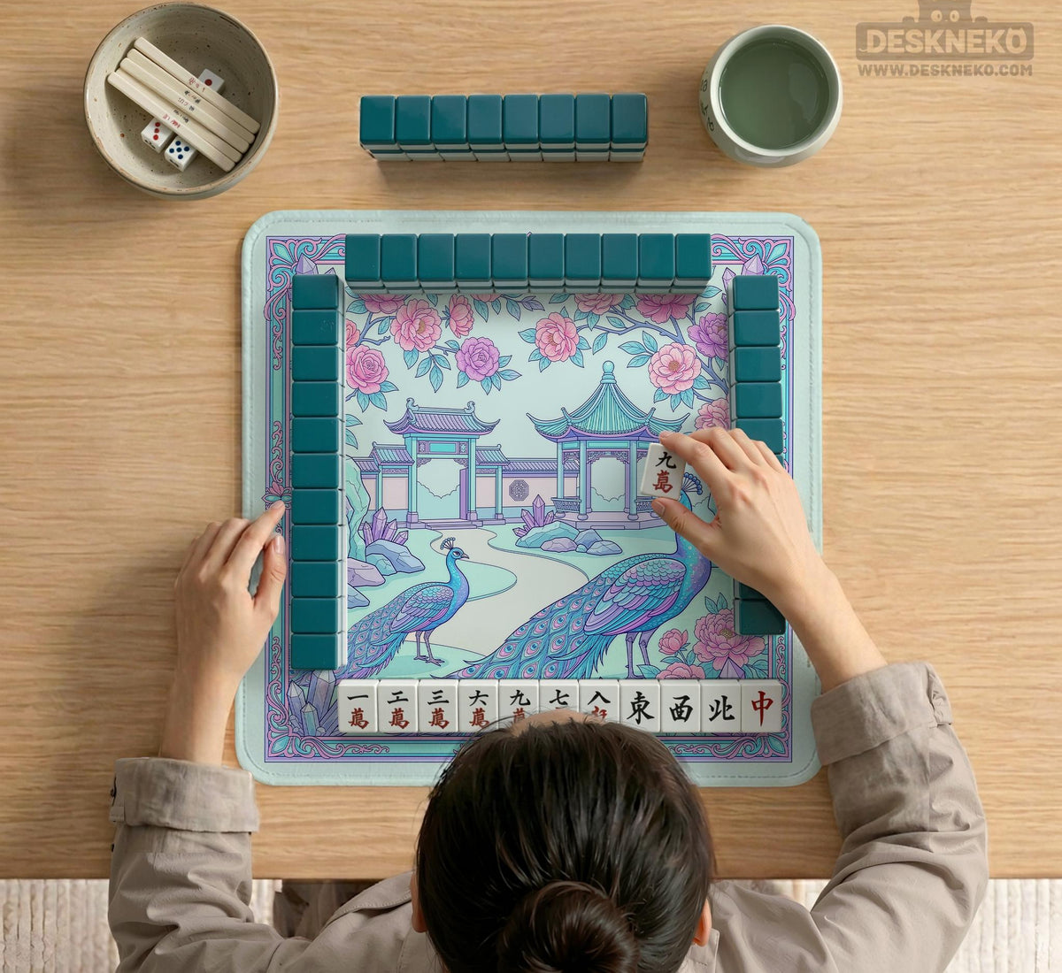 Pastel aqua mahjong table mat with peacock birds, pink flowers, pavilion details, and ornate floral linework.