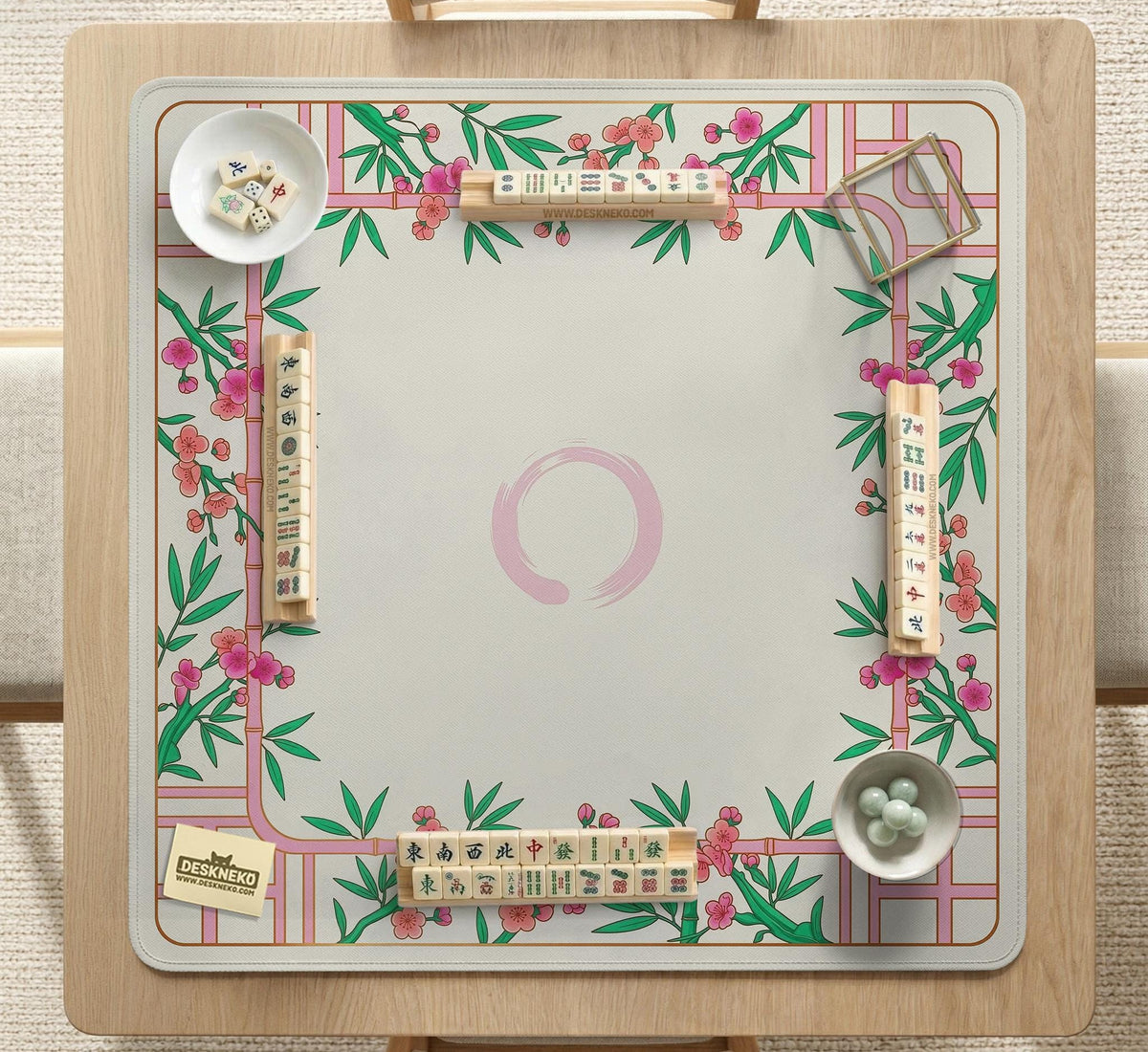 Pink cherry blossom floral mahjong table mat with a cream center and bamboo-style border design.