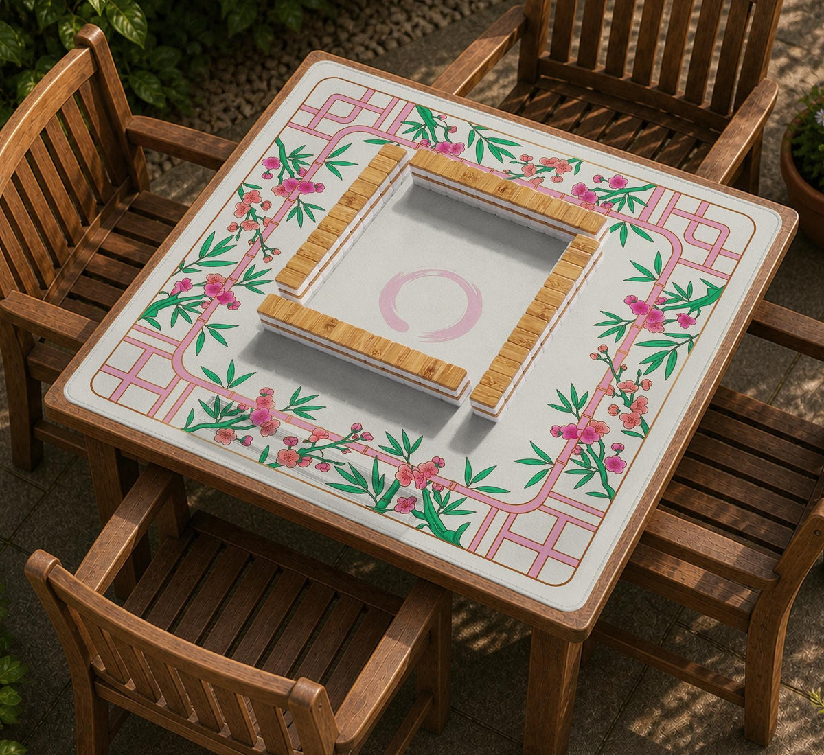 Pink cherry blossom floral mahjong table mat with a cream center and bamboo-style border design.