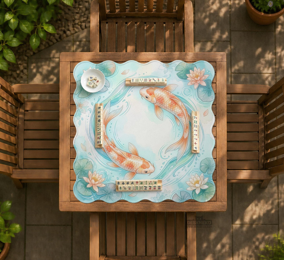 Pastel aqua square mahjong mat with orange koi fish, lotus flowers, lily pads, and flowing water lines.