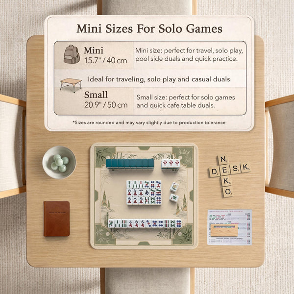 Square mahjong mat with a sage green bamboo and mountain design, cream center, scalloped border details, and gold line accents.