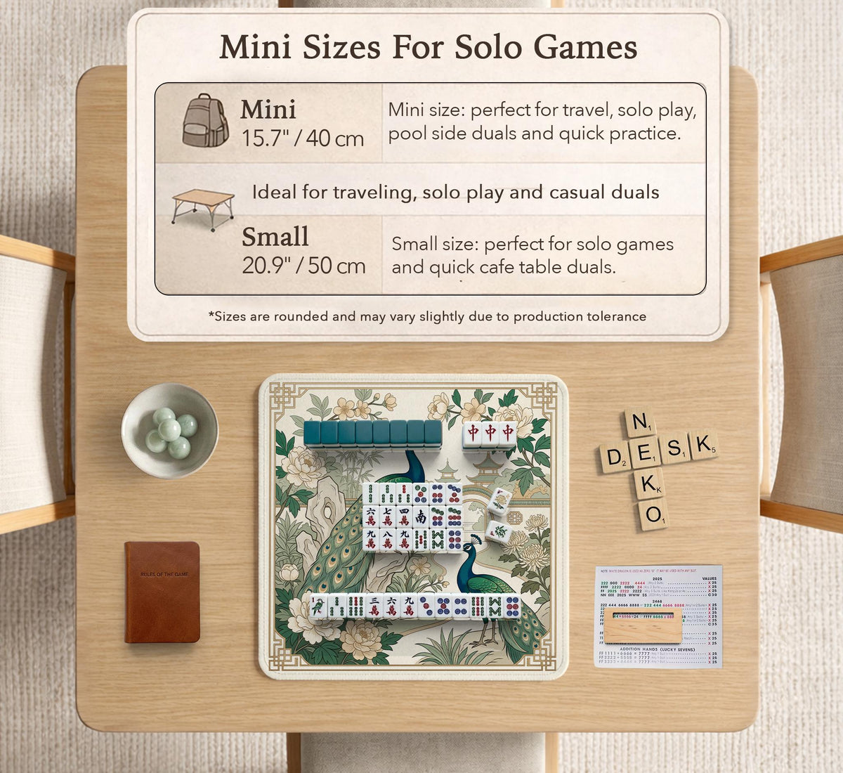 A green mahjong mat with peacock, floral, bamboo, pagoda, and gold border artwork in a scalloped chinoiserie style.