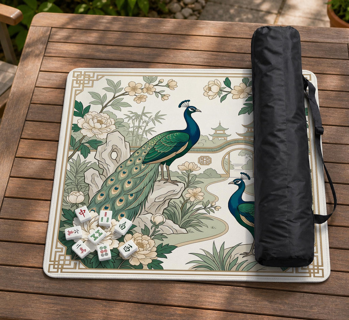 A green mahjong mat with peacock, floral, bamboo, pagoda, and gold border artwork in a scalloped chinoiserie style.