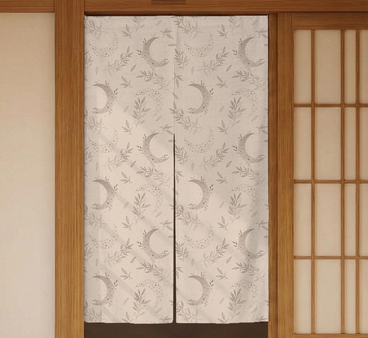 Beige door curtain with a crescent moon, leafy botanical branches, gray line art, and dotted celestial details.
