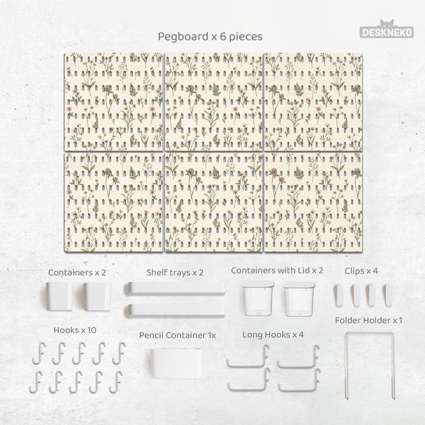 Cream pegboard wall organizer with small floral print, sage green stems, black slot layout, shelves, hooks, clips, and containers.