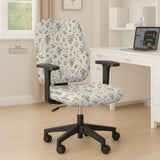 Cream chair cover with a scattered cottage garden floral print in red, blue, yellow, and green on a light background.