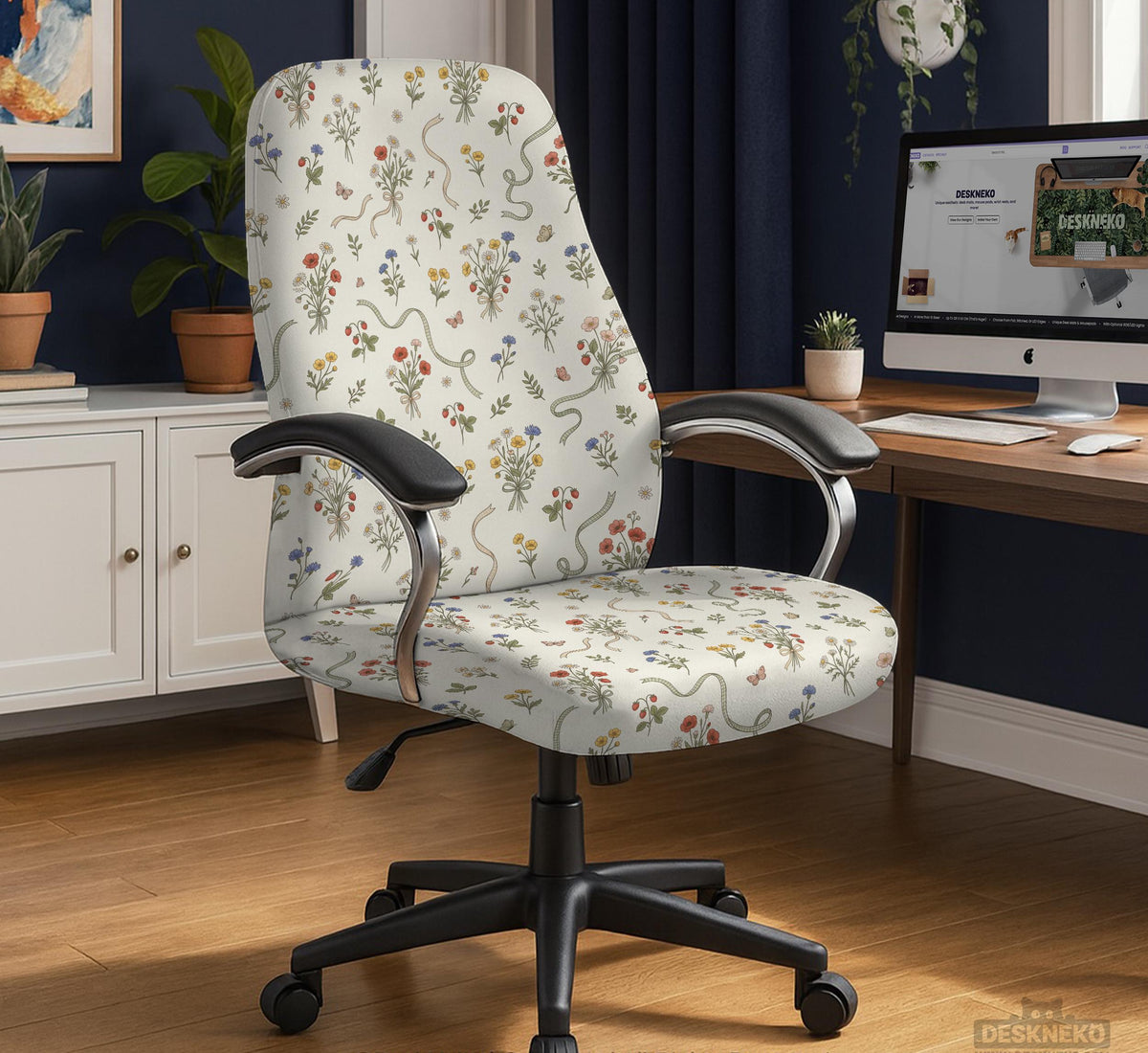 Cream chair cover with a scattered cottage garden floral print in red, blue, yellow, and green on a light background.