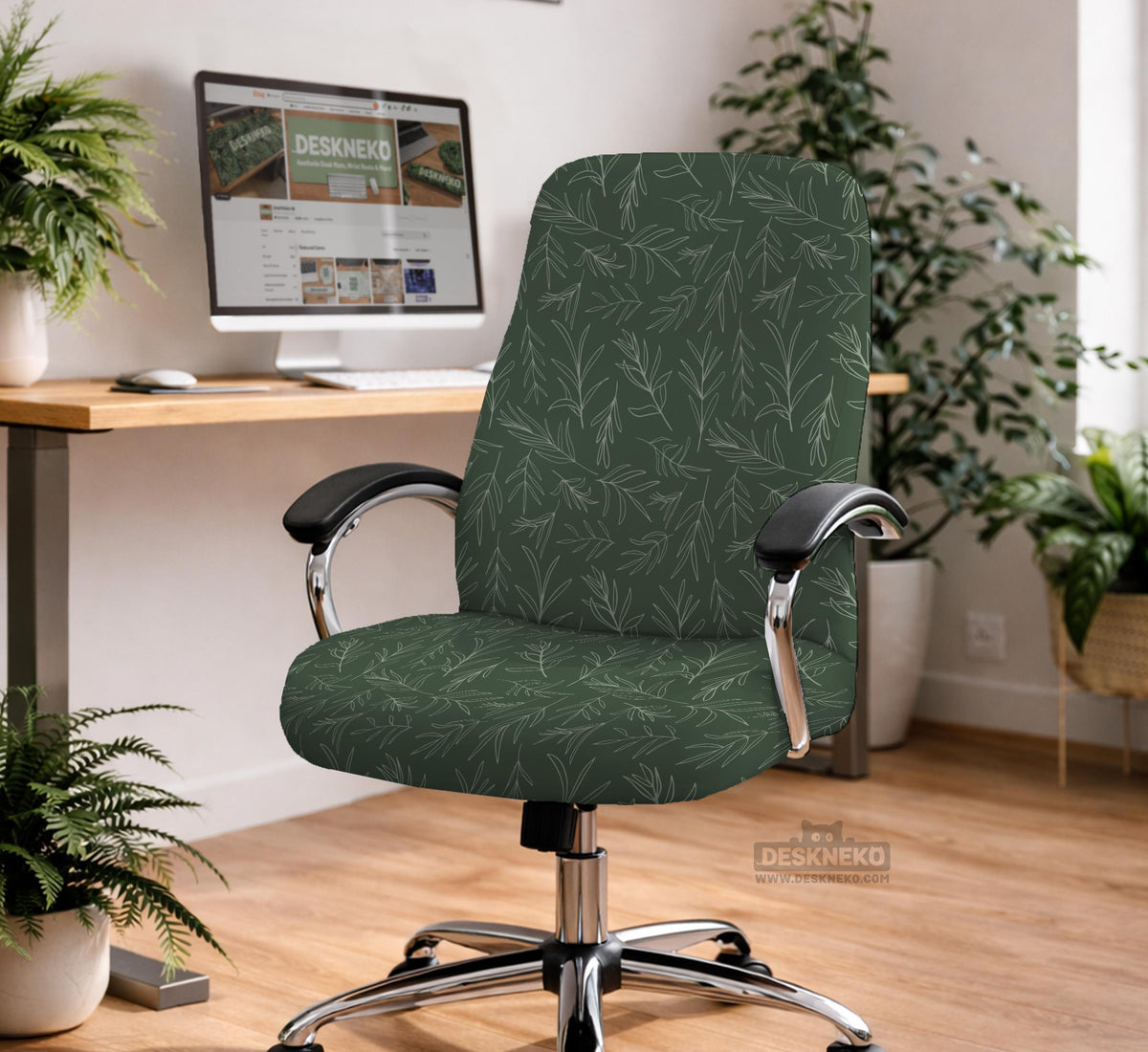 A forest green chair cover with a sage green leaf print shown on a high-back office or gaming chair.