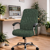 A forest green chair cover with a sage green leaf print shown on a high-back office or gaming chair.