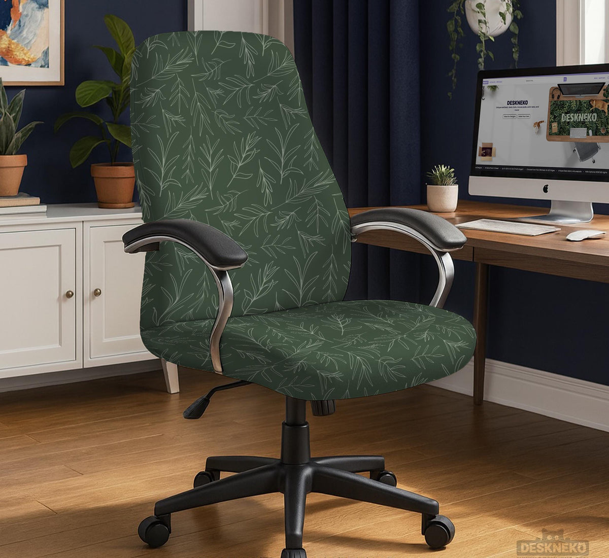 A forest green chair cover with a sage green leaf print shown on a high-back office or gaming chair.