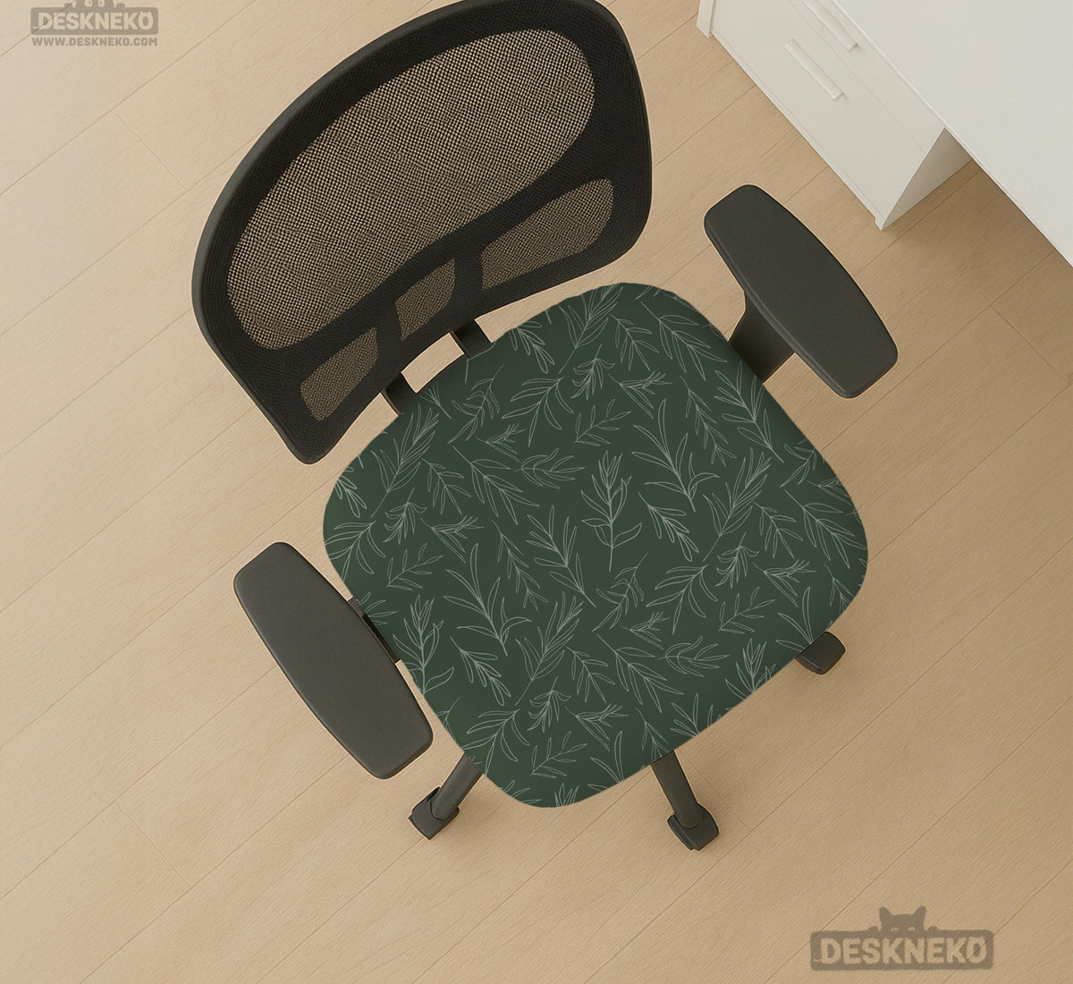 A forest green chair cover with a sage green leaf print shown on a high-back office or gaming chair.