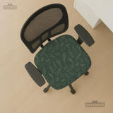 A forest green chair cover with a sage green leaf print shown on a high-back office or gaming chair.