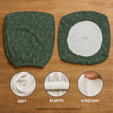 A forest green chair cover with a sage green leaf print shown on a high-back office or gaming chair.