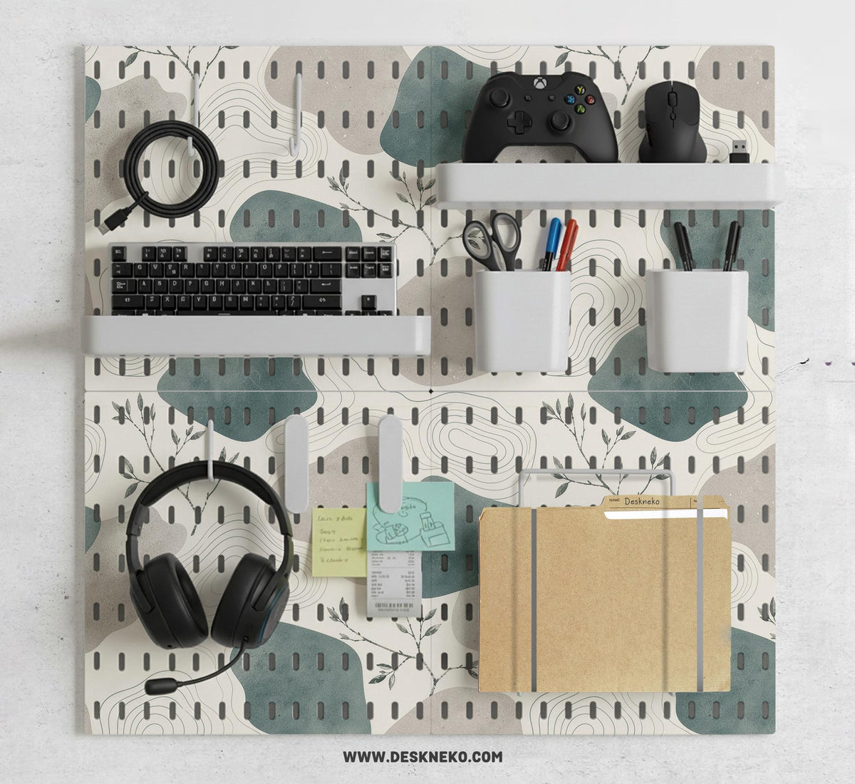 Four pegboard panels in sage green with cream, grey, teal, and leafy botanical artwork arranged in a square layout.