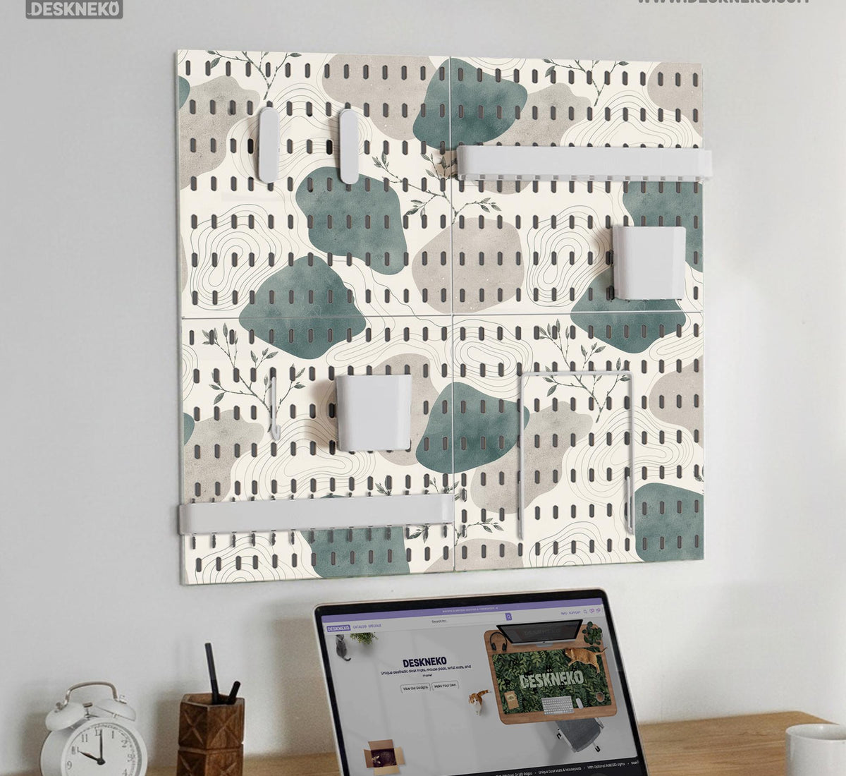 Four pegboard panels in sage green with cream, grey, teal, and leafy botanical artwork arranged in a square layout.