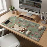 A desk mat with a repeating pattern of cats, leafy houseplants, cactus pots, and small plant-shop style details in sage green.