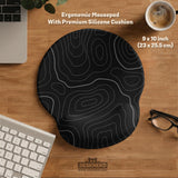 Black mousepad with a gray topographic contour line pattern shown with matching keyboard wrist rest options.