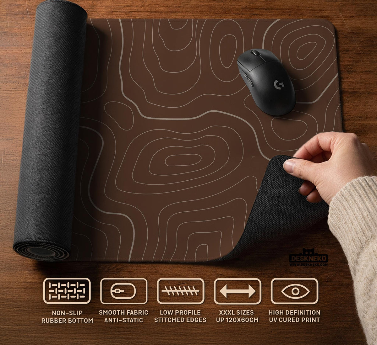 Brown desk mat with a repeating topographic contour line pattern in a neutral earth tone design.