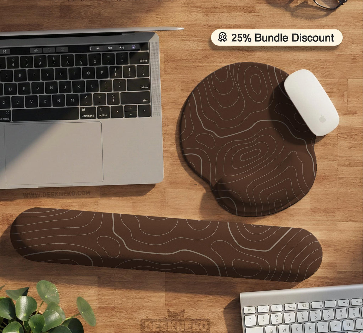 Brown desk mat with a repeating topographic contour line pattern in a neutral earth tone design.