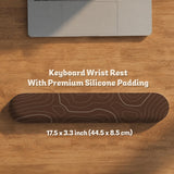 Brown mousepad and keyboard wrist rest with a topographic contour-line pattern.