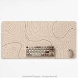 A beige mousepad with a topographic line pattern in a repeating design.