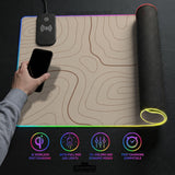 A beige mousepad with a topographic line pattern in a repeating design.
