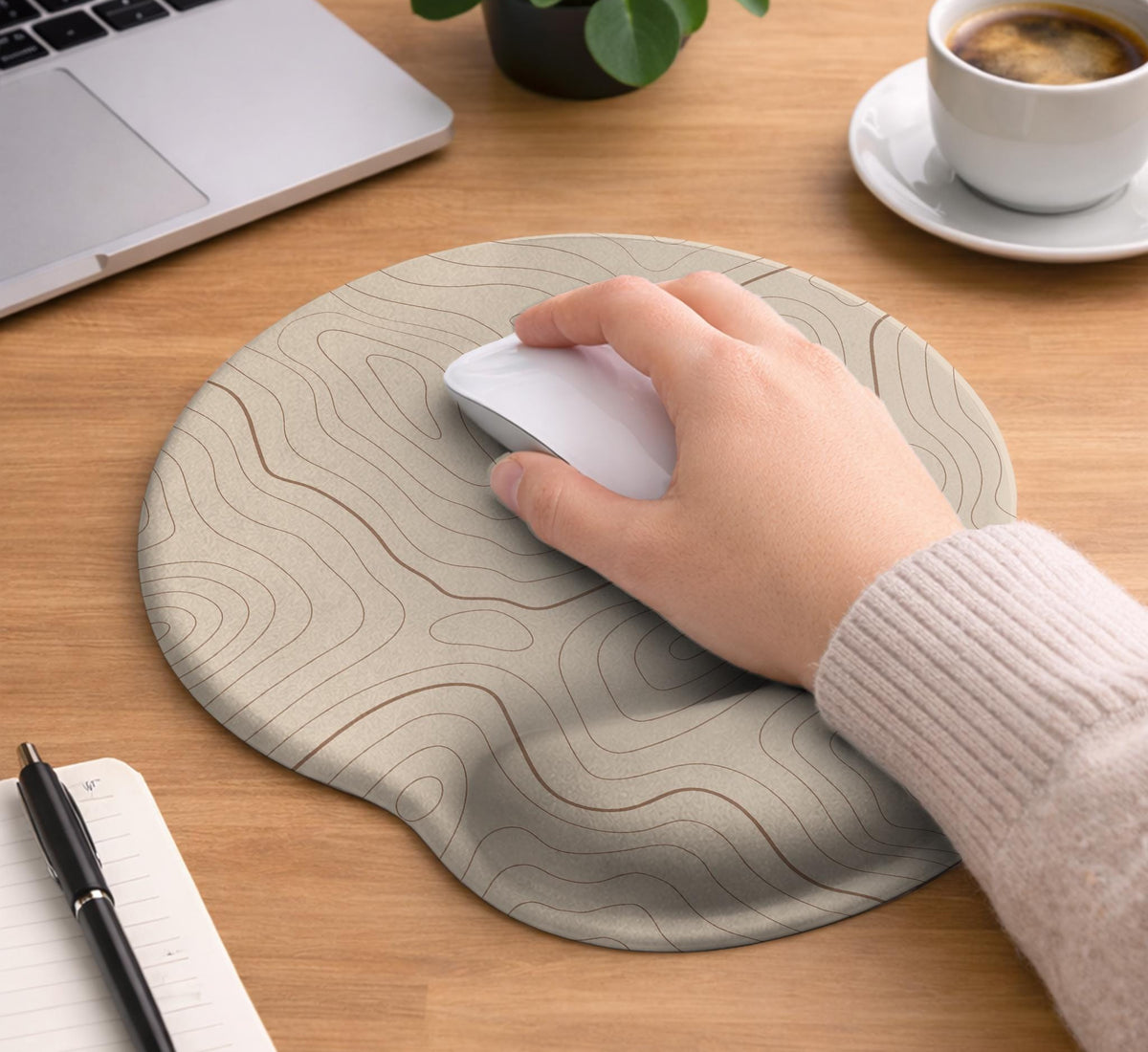 Beige mousepad and keyboard wrist rest with a topographic line pattern shown in a neutral desk setup.