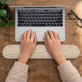 Beige mousepad and keyboard wrist rest with a topographic line pattern shown in a neutral desk setup.