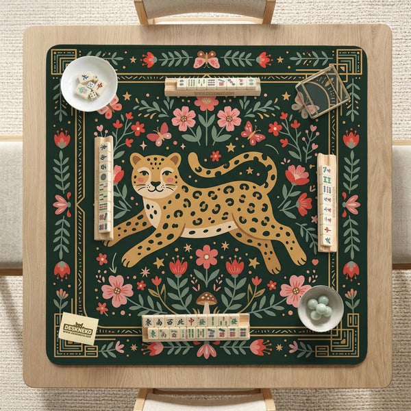 Dark green square mahjong mat with a golden spotted leopard in the center, surrounded by flowers, leafy stems, butterflies, and small star accents.