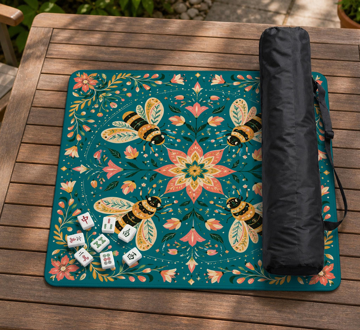 Green mahjong mat with a botanical bee and floral mandala design in teal, coral, cream, and gold.