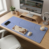 A periwinkle deskmat with thin blue contour lines printed across the surface.