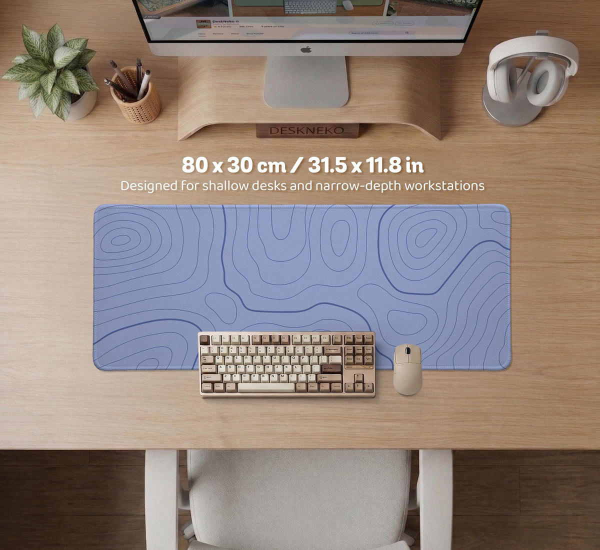 A pastel blue mousepad with an abstract topographic contour line pattern.