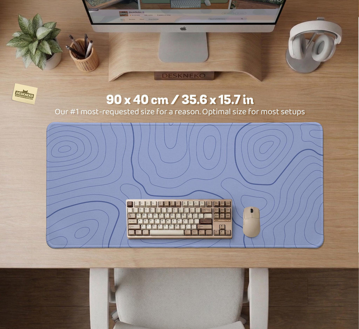 A pastel blue mousepad with an abstract topographic contour line pattern.