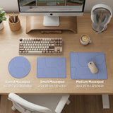 A periwinkle deskmat with thin blue contour lines printed across the surface.