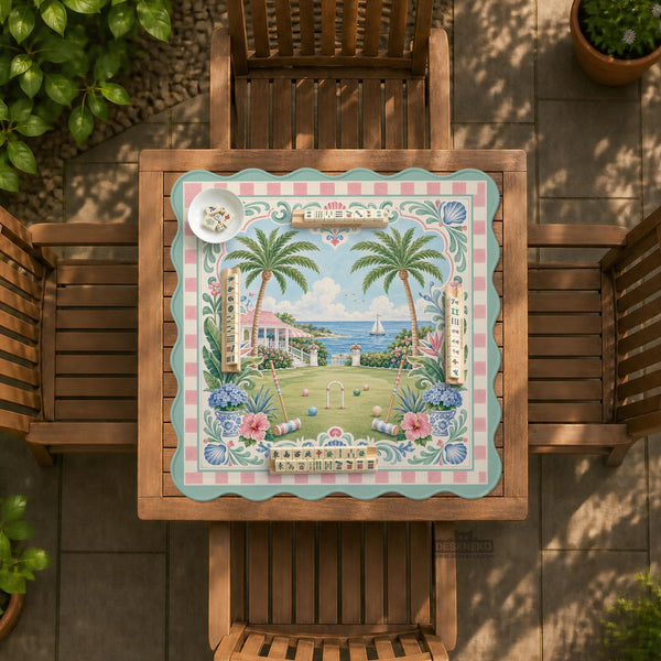 Pastel mahjong mat with a pink gingham border, seashells, hydrangea pots, palm trees, croquet details, and a coastal garden scene.