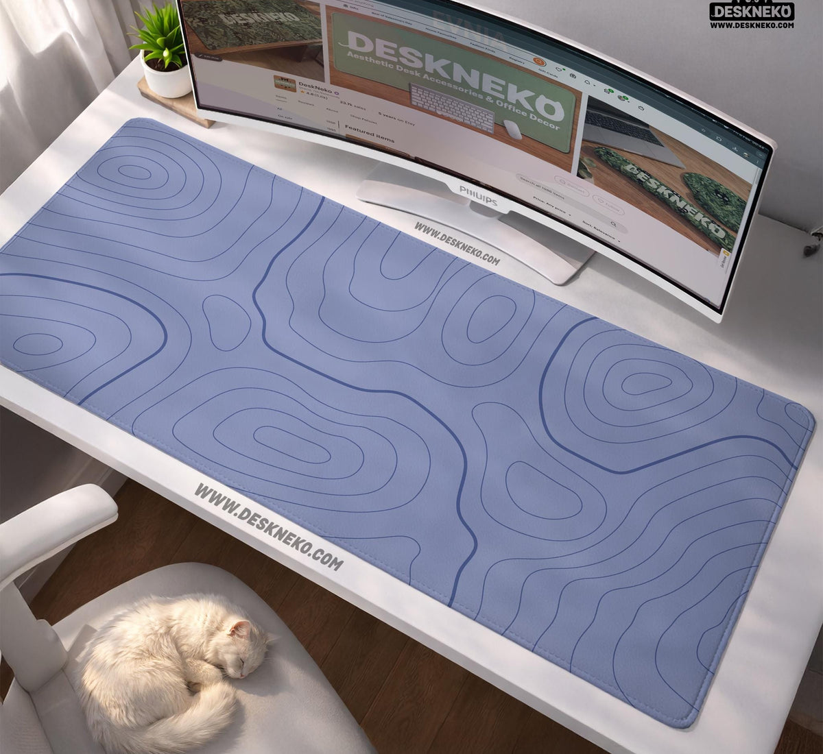 A periwinkle deskmat with thin blue contour lines printed across the surface.