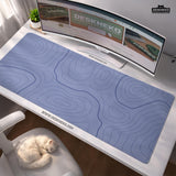 A periwinkle deskmat with thin blue contour lines printed across the surface.